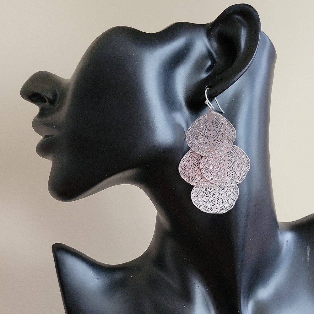 Pair of silver tone ginkgo leaf earrings.